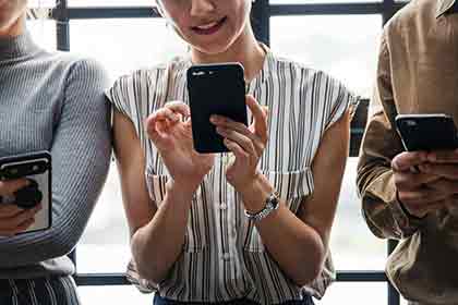 A photo of a woman on her phone