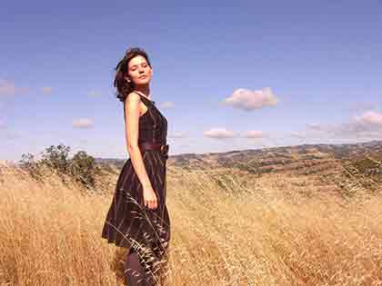 One of the beautiful Ukrainian girls standing in the field.